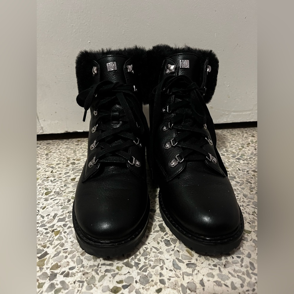 Black leather boots with fur on the ankles.